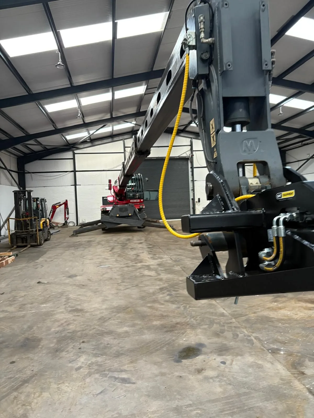 Lorry loader crane and workshop plant during a PUWER work equipment inspection